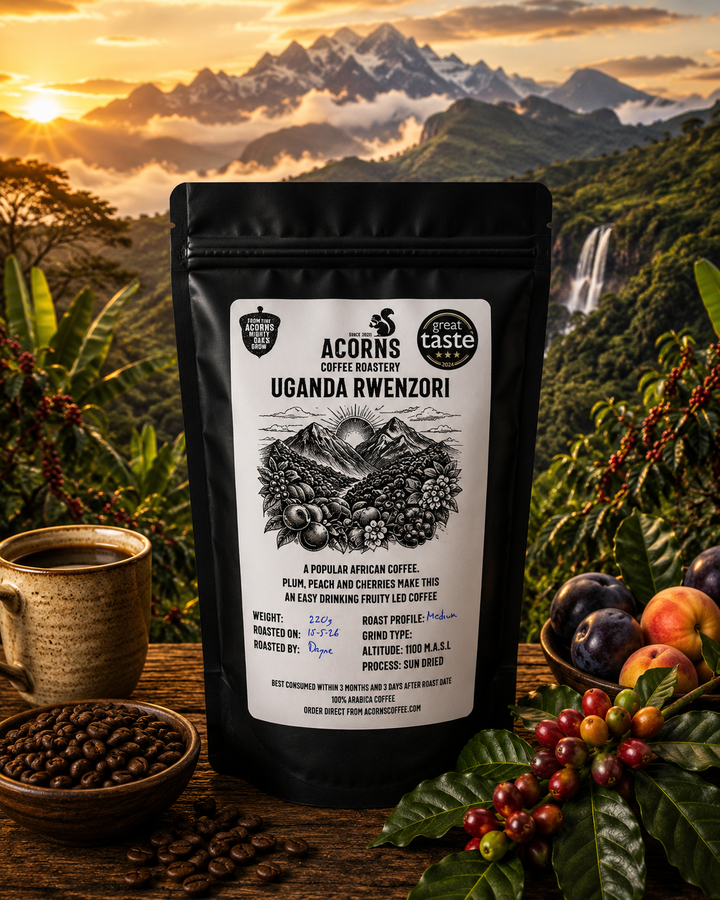 Acorns Coffee Roastery Uganda Rwenzori coffee package with a scenic background