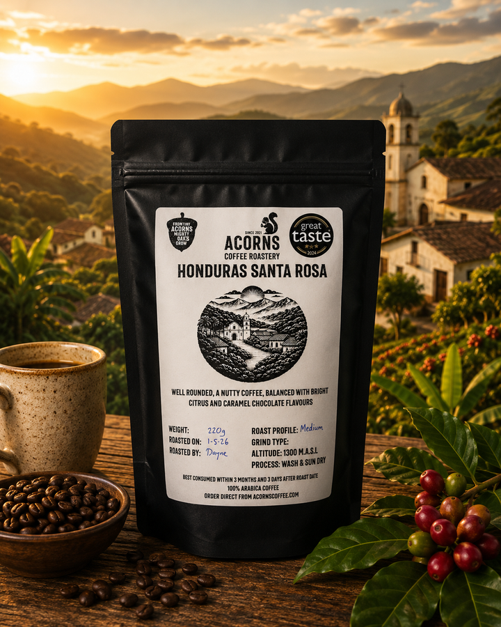 An artistic display of the Honduras Santa Rosa coffee from acorns coffee with a Honduran village at sunset